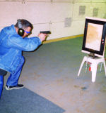 Making bullit holes in the frame at the shooting range